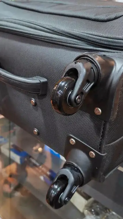 Suitcase with newly replaced wheels