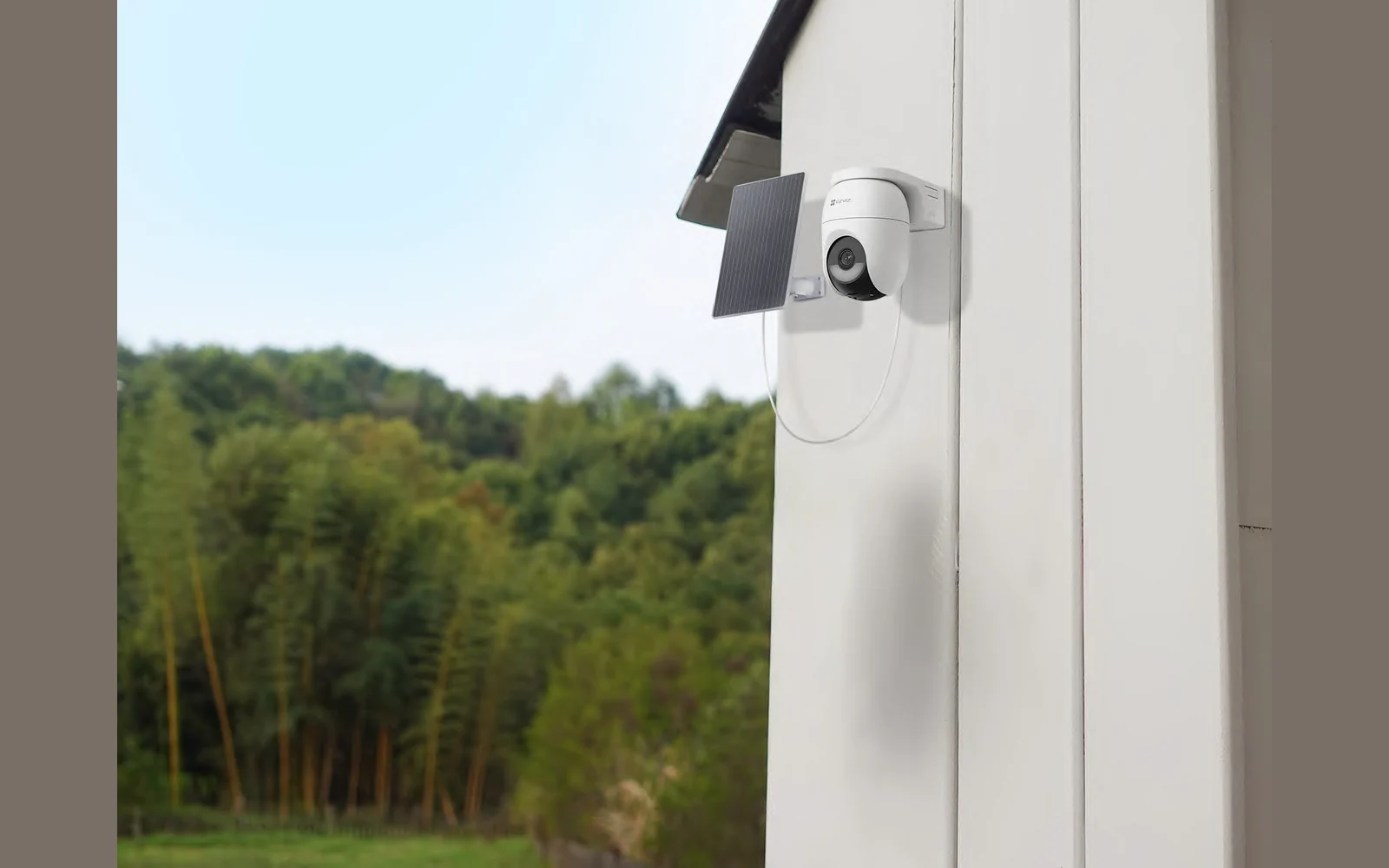 EZVIZ CB8 Lite battery camera with the 5W solar panel mounted on an exterior wall